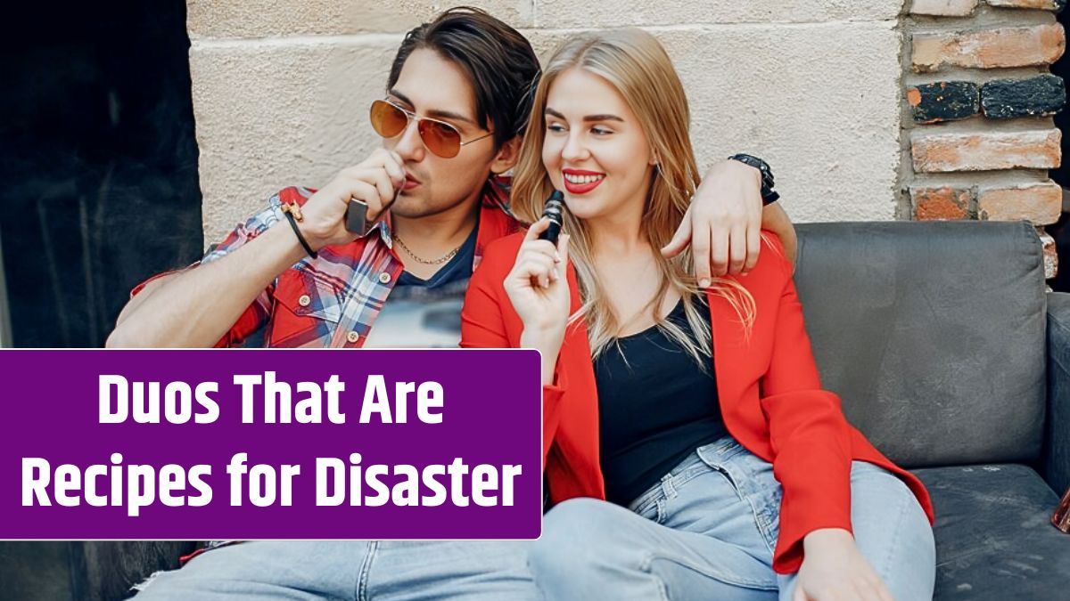 Stylish young couple with vape in a cafe.