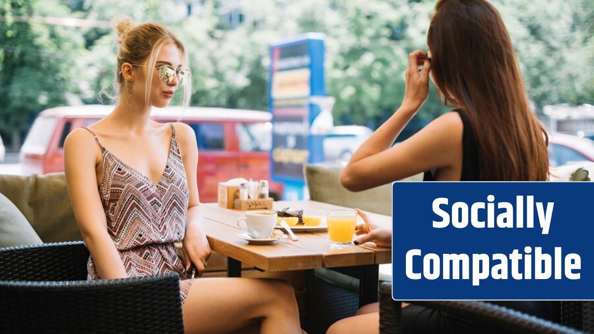 Stylish young woman having breakfast together at cafe.