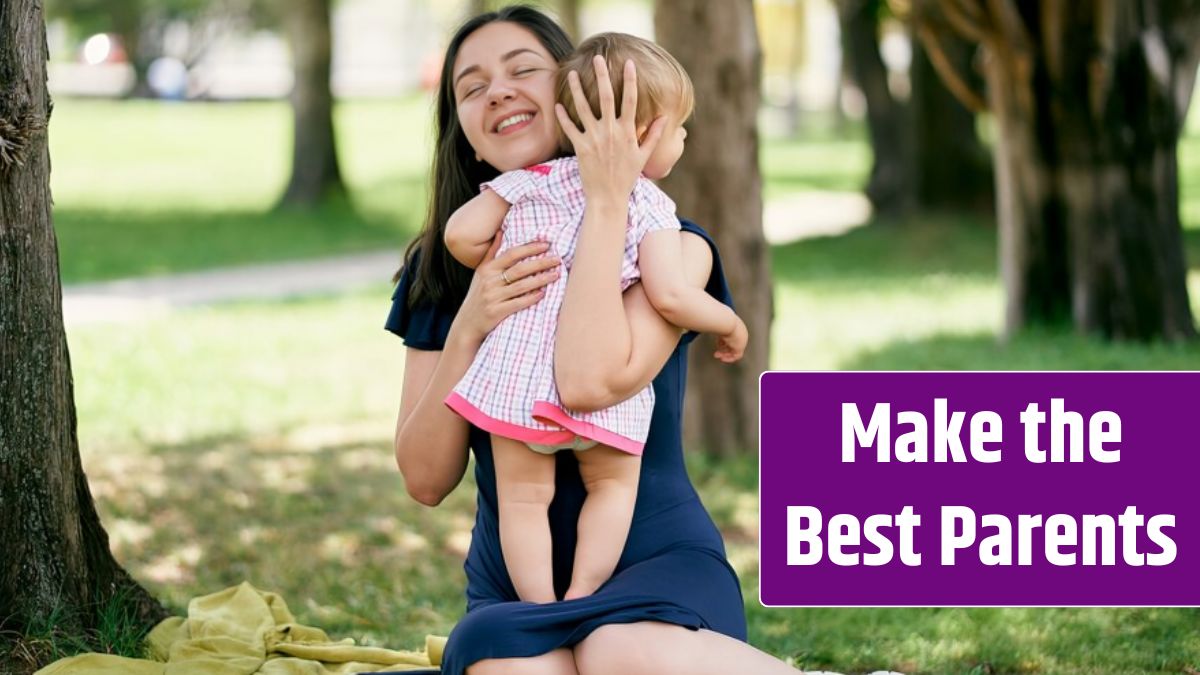 Mom hugs a little girl while sitting on a blanket on the lawn.