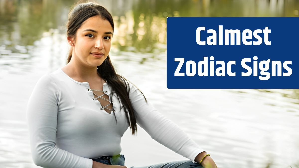 Portrait of beautiful young latin woman sitting by a lake with a golden sunset in the background.