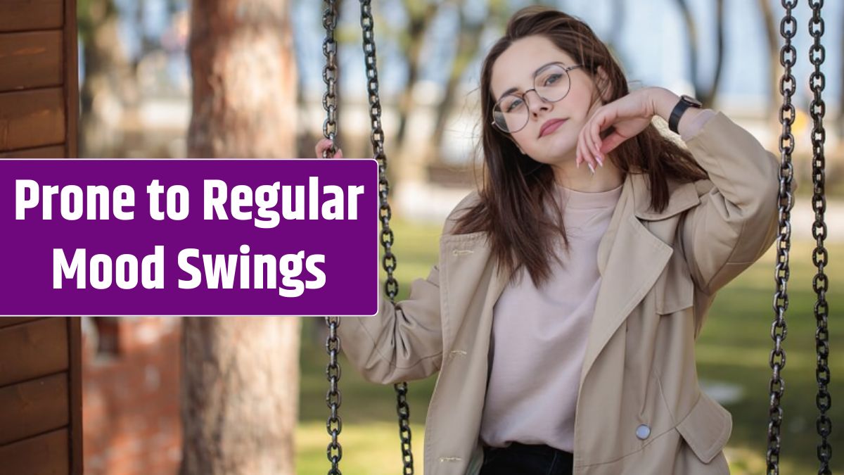 Stylish girl with glasses, outdoors. Teenager girl on a swing, beautiful portrait.