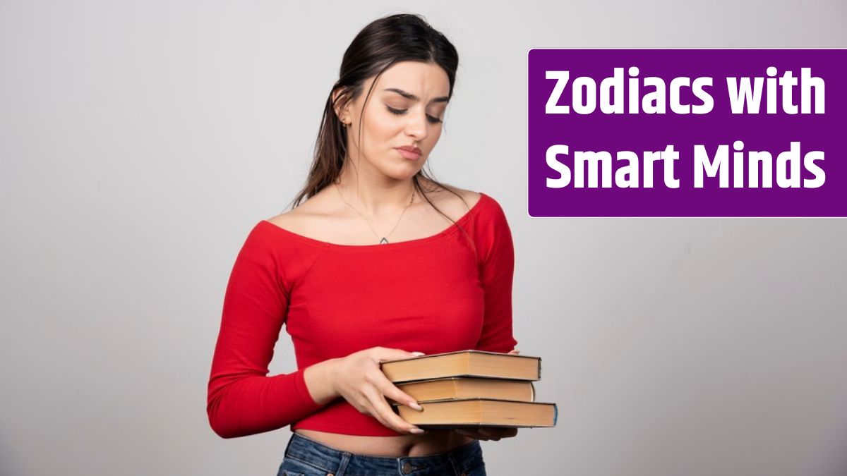 Young woman in red t-shirt looking at a book cover.